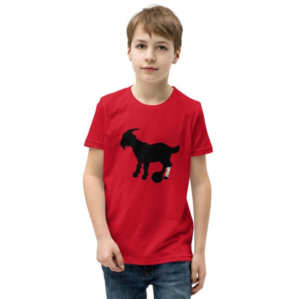 Boy wearing a red staple t-shirt with black goat silhouette with Lionel Messi's famous leg tattoo in light blue and yellow