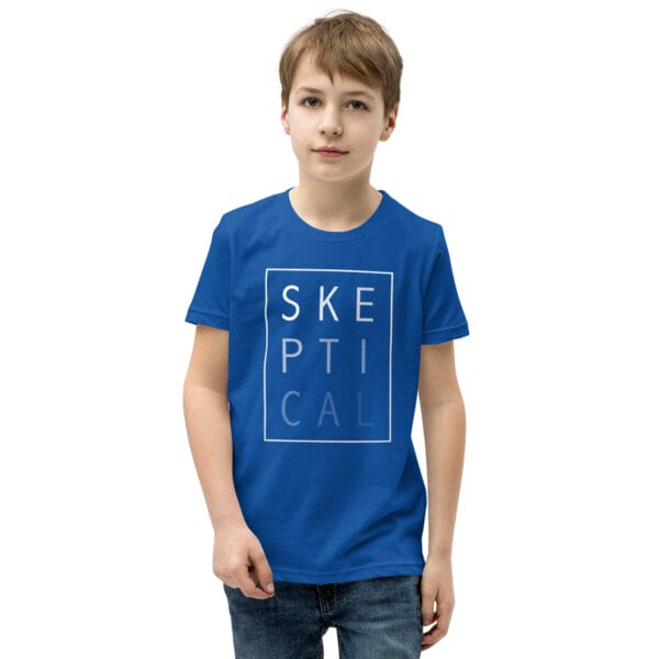 Boy wearing a true royal blue staple t-shirt with white text 'SKEPTICAL' fading out inside a box