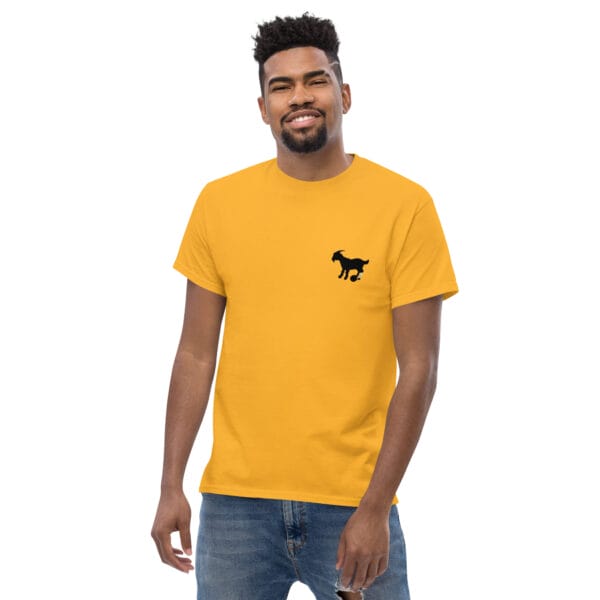 Man wearing a gold men's classic tee small black goat silhouette with Lionel Messi left leg tattoo in blue, yellow and white