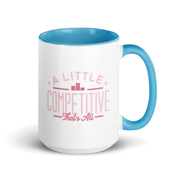 A 15oz white ceramic mug with blue colour inside/handle and text saying 'A little competitive, that's all' in pink