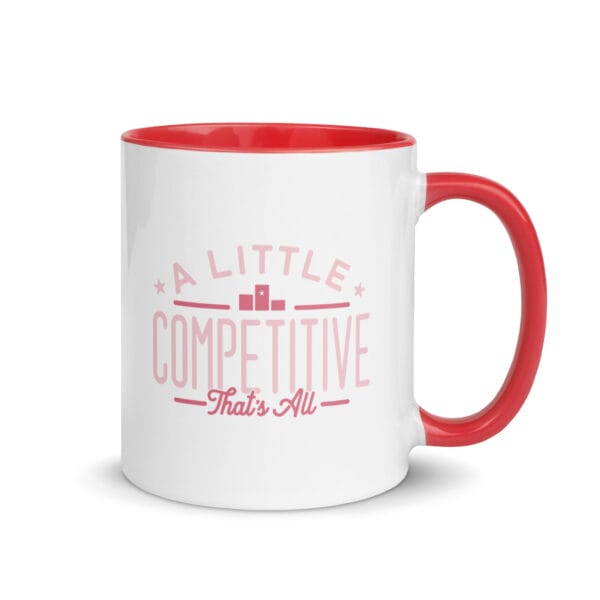A 11oz white ceramic mug with red colour inside/handle and text saying 'A little competitive, that's all' in pink