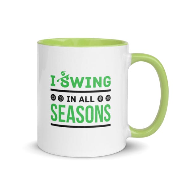 11 ounce golf mug with green handle and colour inside, text 'I swing in all seasons' and four seasonal icons