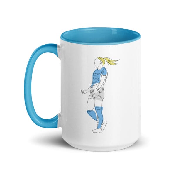 White ceramic 15 ounce mug, blue handle and inside, with two line drawings of Chloe Kelly for Manchester City