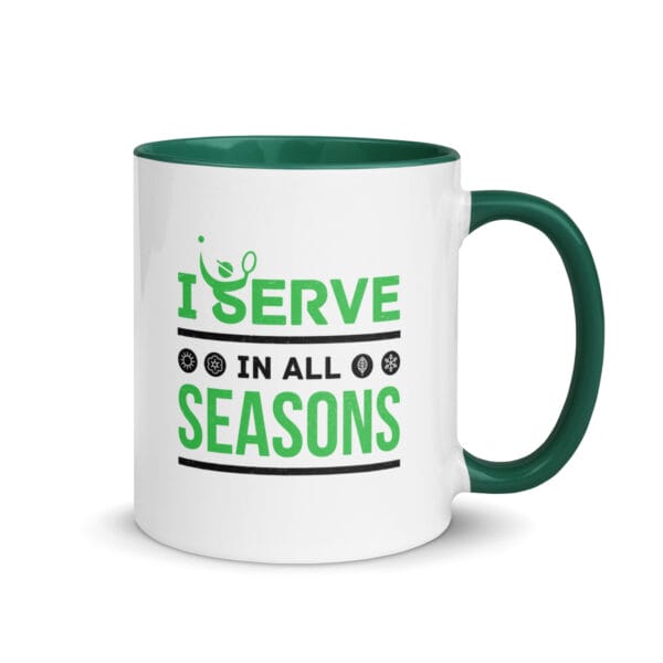 white ceramic 11 ounce tennis mug with dark green handle and colour inside, text outside 'I serve in all seasons' with four seasonal icons