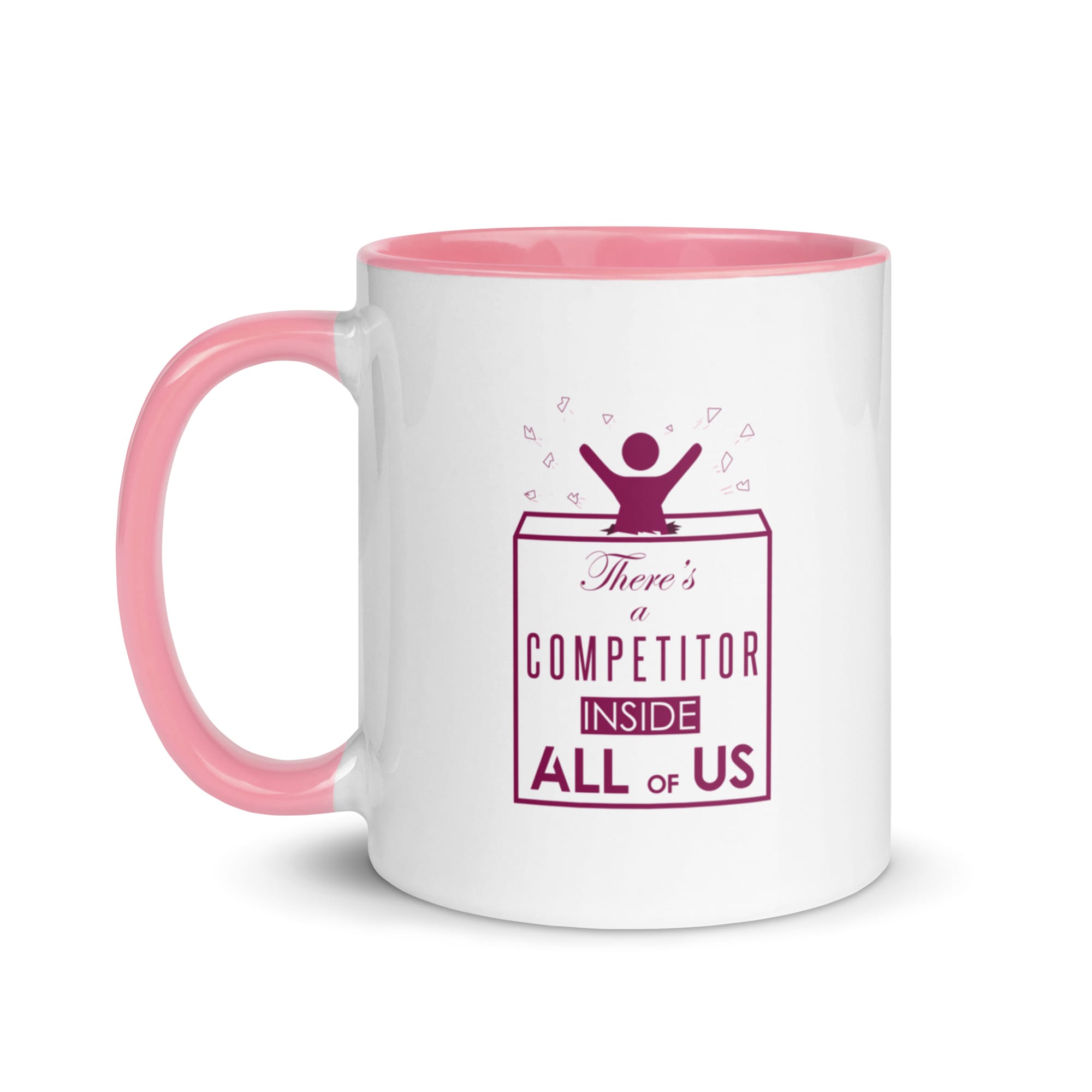 white ceramic mug with pink colour inside, purple text "There's a competitor inside us all" with girl bursting out of a box