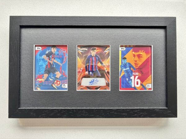Pedri memorabilia display of three trading cards with one of them signed by Pedri