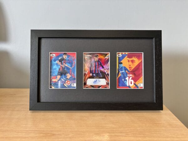 Pedri memorabilia display standing upright using leg stand on bedside table