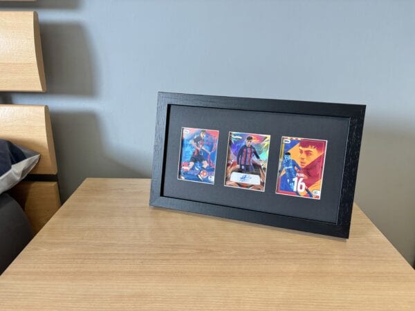 Pedri memorabilia display standing upright on bedside table