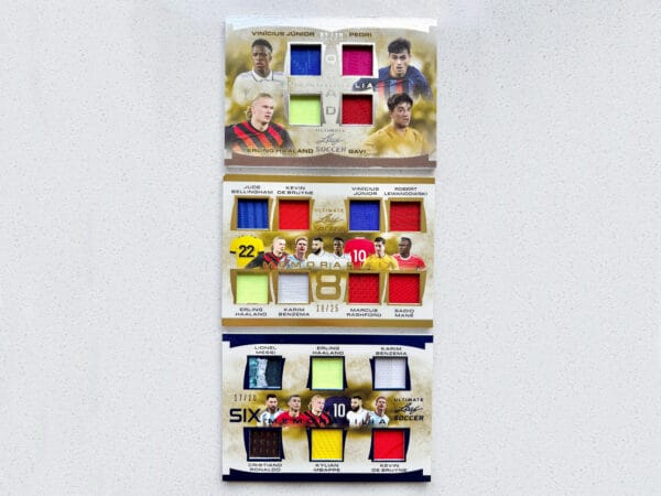Football memorabilia, three sports trading cards from front showing 18 game-worn relics, including Messi, Ronaldo, Haaland