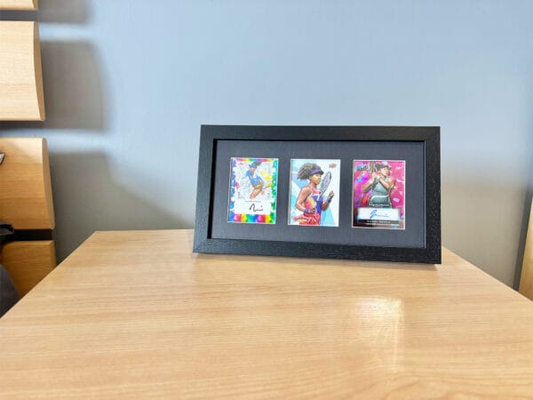 Naomi Osaka memorabilia black display case sitting on bedside table using optional leg stand, Osaka two autographs