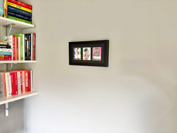 Naomi Osaka memorabilia black display case hanging on the wall, Osaka two autographs