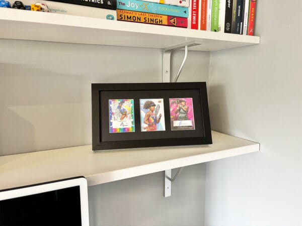 Naomi Osaka memorabilia black display case on shelf using optional leg stand, two autographs