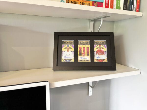 Michael Owen memorabilia display case standing on shelf using optional leg stand, three autographs from Owen, including rare 1 of 1
