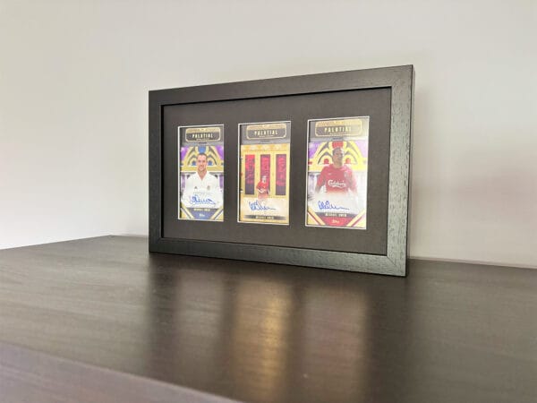 Michael Owen memorabilia display case standing upright on surface, three autographs from Owen, including rare 1 of 1