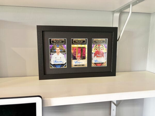 Michael Owen memorabilia display case standing upright on shelf, three autographs from Owen, including rare 1 of 1
