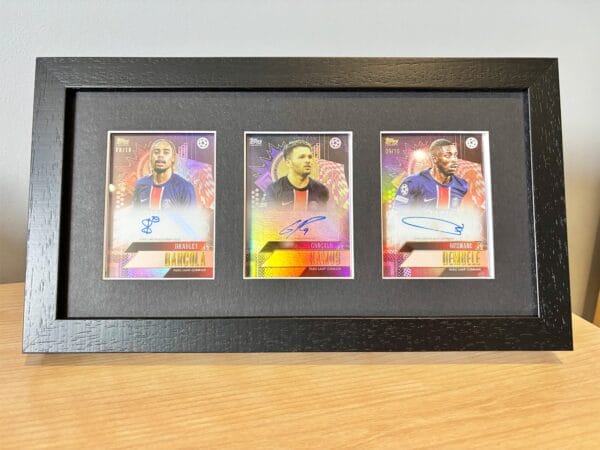 PSG memorabilia display with Barcola, Ramos and Dembele autographs on bedside table using optional leg stand