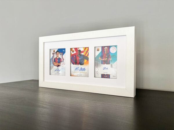 Barcelona 125th Anniversary memorabilia display, white frame, three signed sports cards from Victor, Rivaldo and Olmo