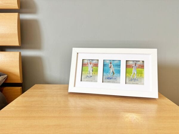 England cricket memorabilia white display case standing on bedside table, autographs from Trott, Flintoff and Broad