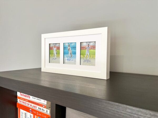England cricket memorabilia white display case standing upright, autographs from Trott, Flintoff and Broad