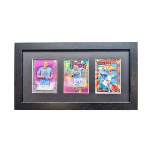 Erling Haaland autograph and relic display, black frame holding three sports cards