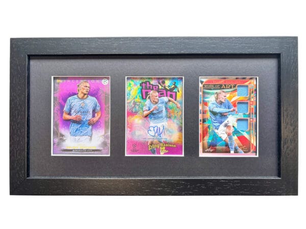 Erling Haaland autograph and relic display, black frame holding three sports cards