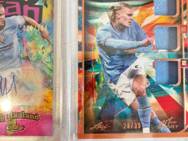 Erling Haaland sports cards close up showing the numbered parts